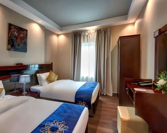 Al Bustan Tower Hotel Suites - Sharjah - Habitación