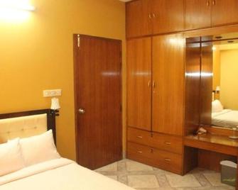 Maple Crest Service Apartment - Dacca - Camera da letto