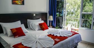 Sunny Suites Inn - Malé - Camera da letto