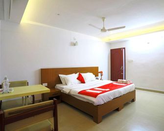 호텔 암마 레지던시 - 칼라디 - 침실