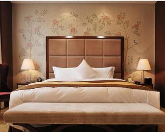Yangzhou Hentique Huijin Resort Hotel - Yangzhou - Bedroom