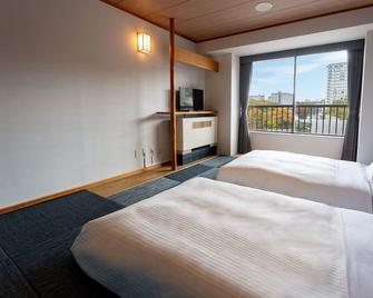 Kamenoi Hotel Kusatsu Yubatake - Kusatsu - Bedroom