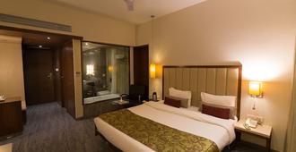 Sentosa Resorts and Water Park - Pune - Bedroom