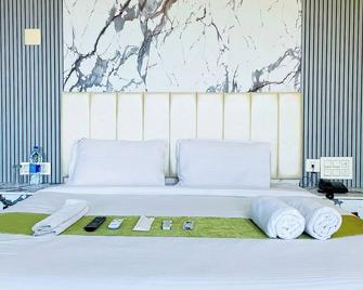 Hotel Heraa Inn - Mangalore - Slaapkamer