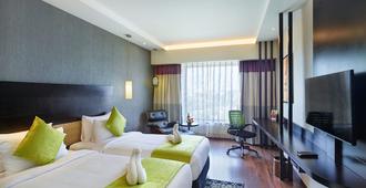 Hycinth Hotels - Thiruvananthapuram - Schlafzimmer
