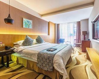 Family Tianzhongxing Hotel Zhumadian - Zhumadian - Bedroom