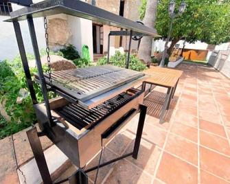 La Palmera. Casa rural con piscina privada. - Benadalid - Patio