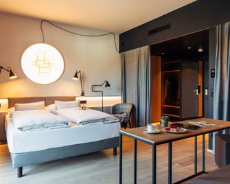 harry's home Telfs hotel & apartments - 泰爾夫斯 - 臥室