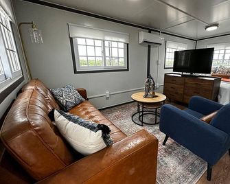 Boxhouse Villages Monahans, Queen Bed - Monahans - Living room