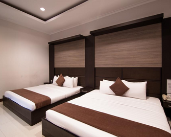 Surya Kencana Seaside Hotel - Pangandaran - Habitación