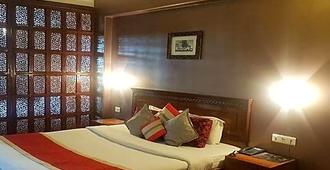 Hotel Wingait Inn - שימלה - חדר שינה