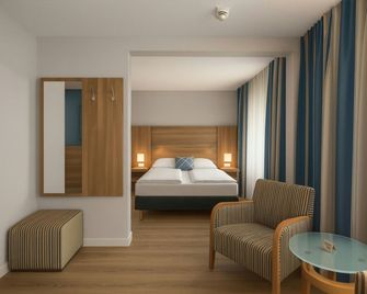Four Points Flex by Sheraton Kiel - Kiel - Schlafzimmer
