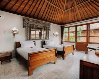 The Ariras Resort - Manggis - Schlafzimmer
