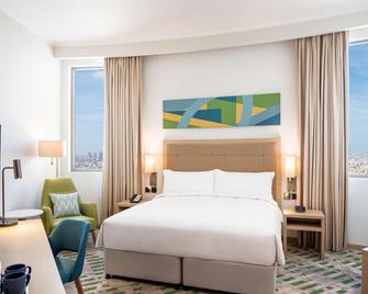 Holiday Inn & Suites Dubai Science Park - Dubaj - Sypialnia