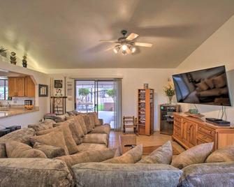 Kick Back Corral with Private Hot Tub and Yard! - Anthem - Living room