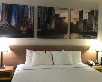 Days Inn & Suites by Wyndham Romeoville - Romeoville - Bedroom