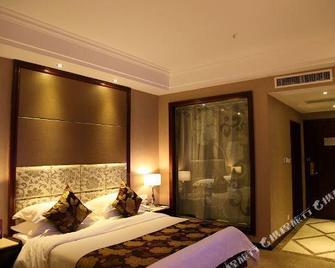 Four Seasons Moon Hotel - Liang-šan - Ložnice