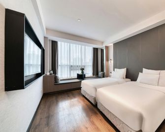 Tiangang Manfei Hotel (Ningbo Railway Station Lianfeng Metro Station Branch) - Ningbo - Bedroom