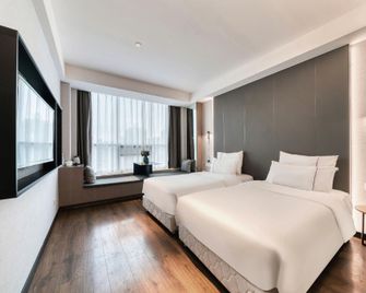 Tiangang Manfei Hotel (Ningbo Railway Station Lianfeng Metro Station Branch) - נינגבו - חדר שינה