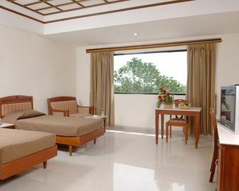Hotel Arcadia - Kottayam - Спальня