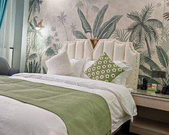 Snail House Hotel (Luoyang Railway Station David World Branch) - Luoyang - Bedroom