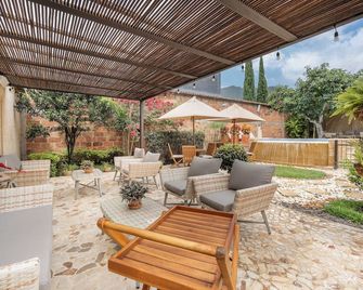 Casa Passiflora Hotel Boutique - Jardín - Patio