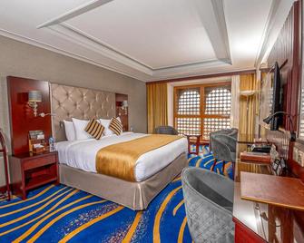 Dar Al Taqwa Hotel - ดีนะห์ - ห้องนอน