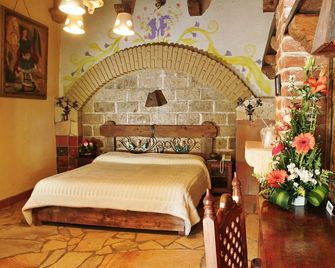Hotel Hacienda Don Juan - סן קריסטובל דה לס קאסאס - חדר שינה