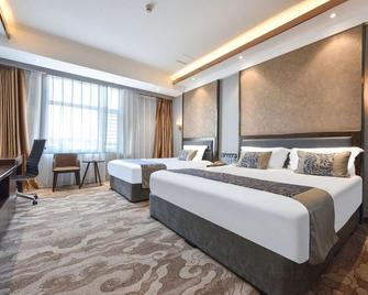 Dandong Rising Zhonglian Hotel - Dandong - Bedroom