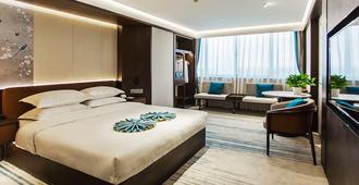 Golden Port Hotel - נינגבו - חדר שינה