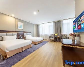 Riyue International Hotel - Qiandongnan - Bedroom