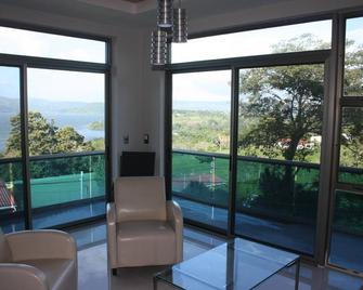 Second Level Luxury Condo with Astonishing Lake Arenal Views - Tilarán - Living room