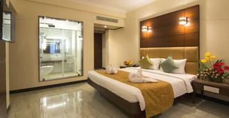 Shenbaga Hotel & Convention Centre - Pondicherry - Schlafzimmer