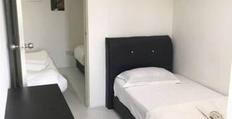 Pg Inn - Kuching - Habitación