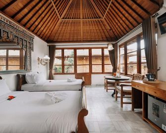 The Ariras Resort - Manggis - חדר שינה