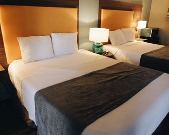 Budgetel Inn & Suites - ממפיס - חדר שינה