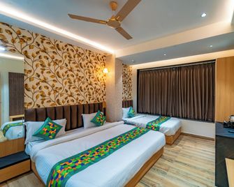 Treebo Neel Orchid - Ujjain - Camera da letto