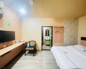 Haitian Business Hostel - Ürümqi - Bedroom
