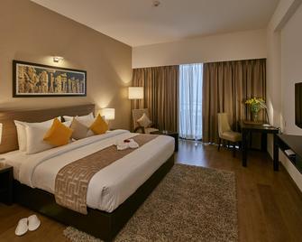 Signature Club Resort - באנגאלור - חדר שינה