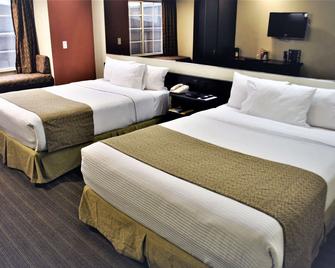 Microtel Inn & Suites by Wyndham Toluca - Toluca - Спальня