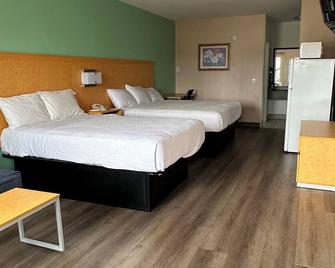 Security Inn & Suites - Lake City - Bedroom