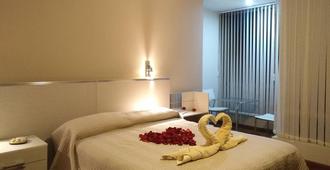 Hostal Costa De Marfil Suites & Apartamentos - Cochabamba - Bedroom
