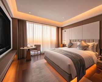Yangzhou East High-speed Railway Station Elite Hotel - Yangzhou - Schlafzimmer
