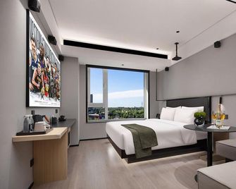 Mehood Lestie Hotel (Shenbei University Town Fantawild Store) - Shenyang - Schlafzimmer