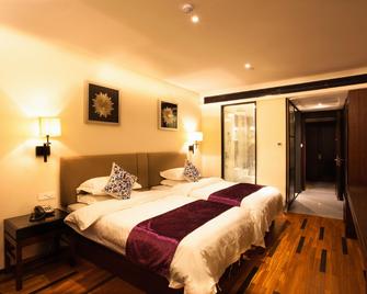 Junting Huafeng Hotel - Bozhou - Schlafzimmer