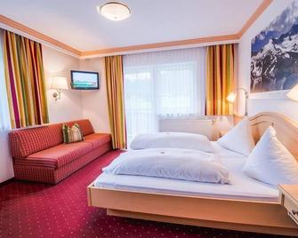 Hotel Grundlhof - Bramberg am Wildkogel - Bedroom