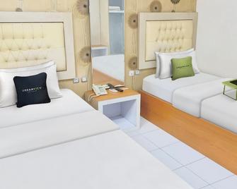Urbanview Hotel Niraz Syariah Banjarmasin by RedDoorz - Банджармасін - Спальня