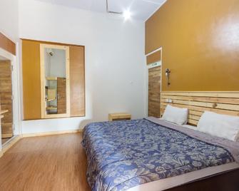 Zaen Hotel Syariah Solo - Surakarta - Slaapkamer