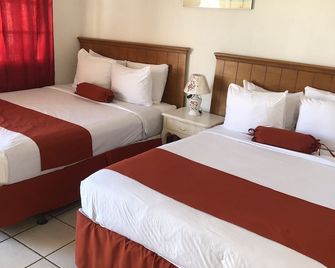 كونينجسبي إن - مدينة بليز - غرفة نوم