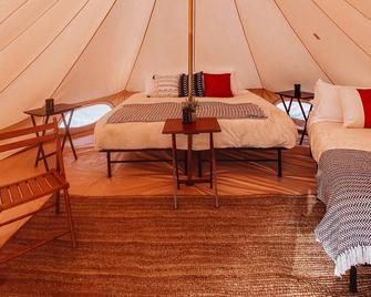 Twin Tent w/ Shared Bathroom - Beauty awaits you just past the red cliffs. - Tropic - Bedroom